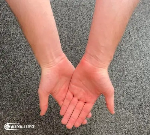 How to make proper hand position for volleyball bumps, passes, and digs Step 3: Keeping your fingers in place, swivel your palms 45 degrees towards your body.